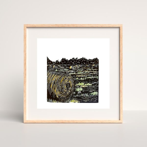 framed original linocut print of hay bales in a field by Dehlia Barnard-Edmunds
