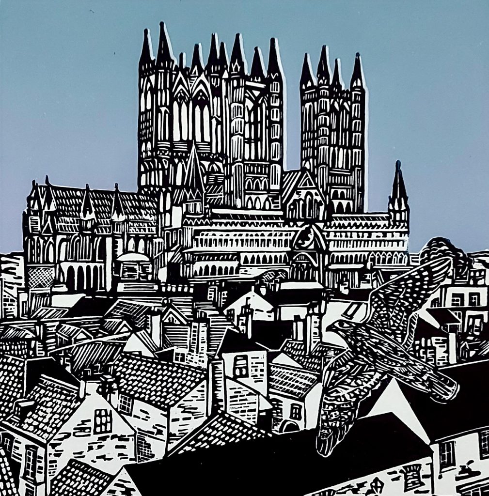 An Original Linocut Print by Printmaker Dehlia Barnard-Edmunds of Lincoln Cathedral with mauve background and black detail.