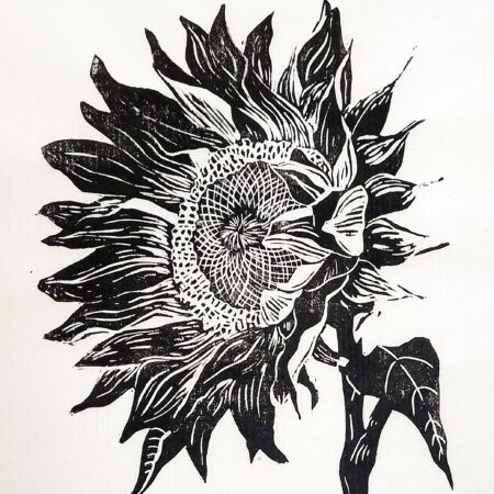 Handmade linocut limited edition print of a sunflower facing the left in blacl and white by Dehlia Barnard-Edmunds