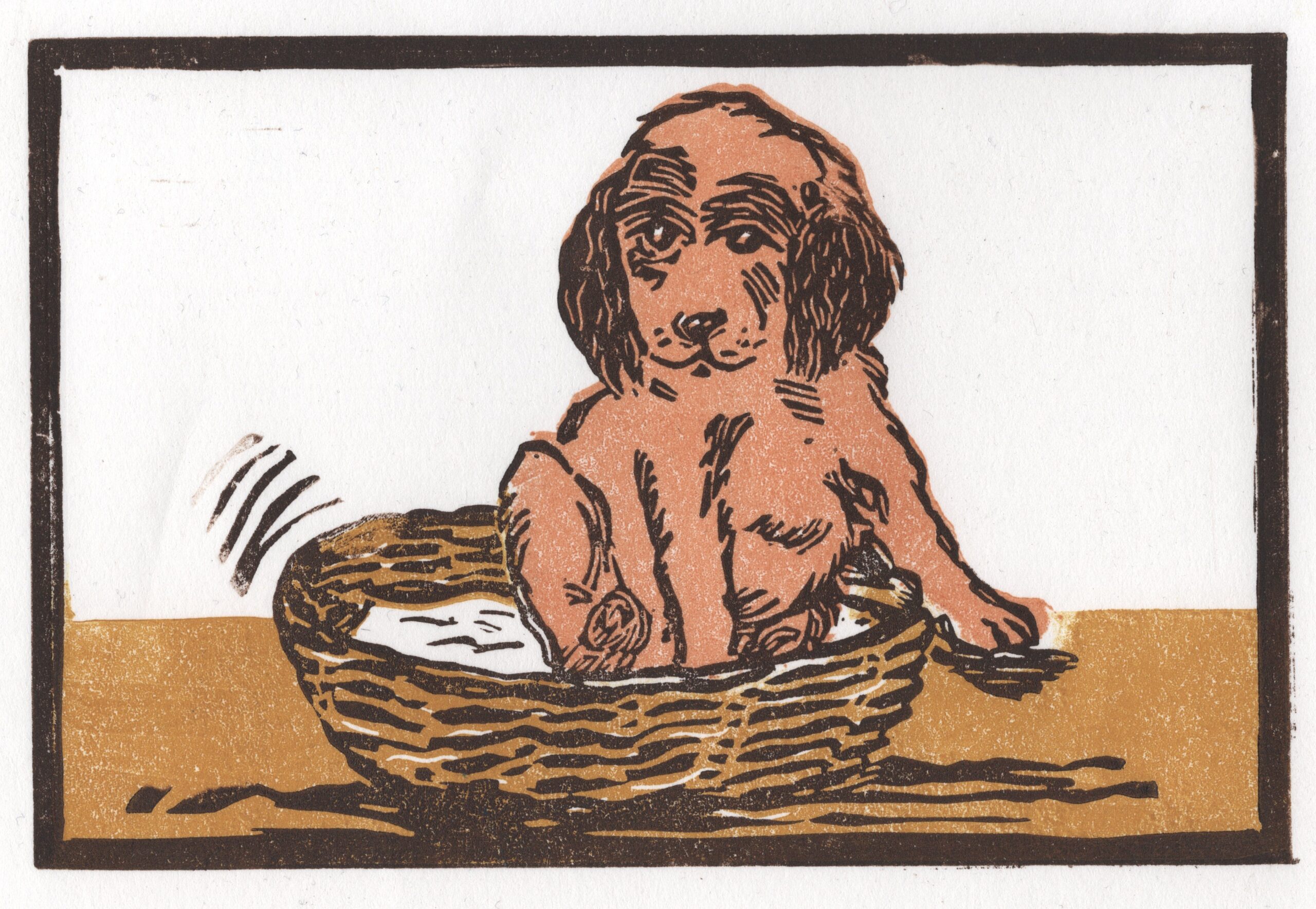 Multi block lino print of a puppy in a basket by Dehlia Barnard-Edmunds aka The Merryweather Artist